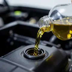 Engine oil being added to an engine
